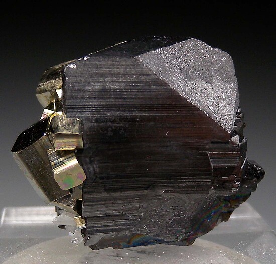 Pyrite on Ferberite