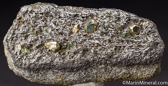 Pyrite, Tsavorite on Graphite