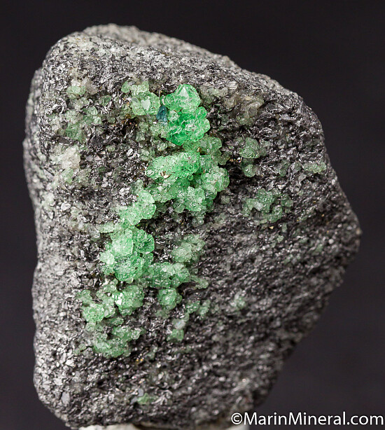 Tsavorite with Pyrite on Graphite
