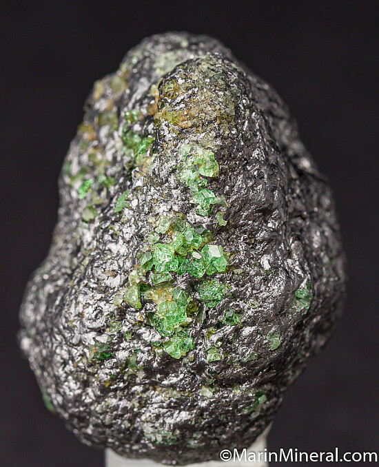 Tsavorite with Pyrite on Graphite