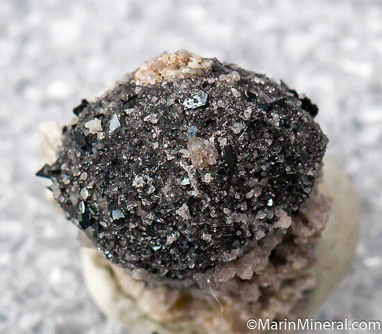 Bixbyite on Hematite after Garnet