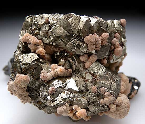 Rhodochrosite and Sphalerite on Pyrite psuedo. Pyrrhotite
