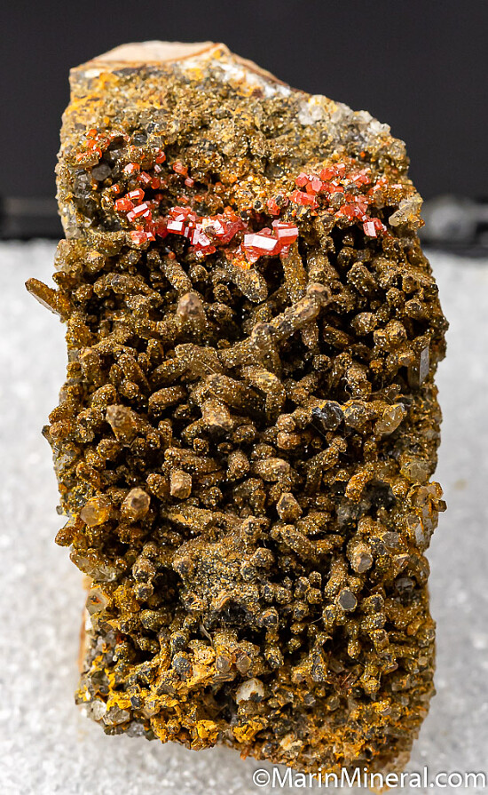 Vanadinite on Descloizite over Quartz