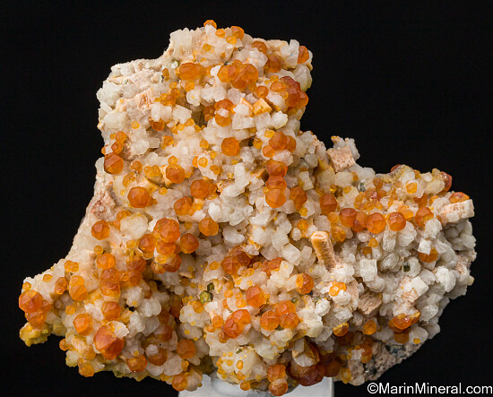 Spessartine on Orthoclase