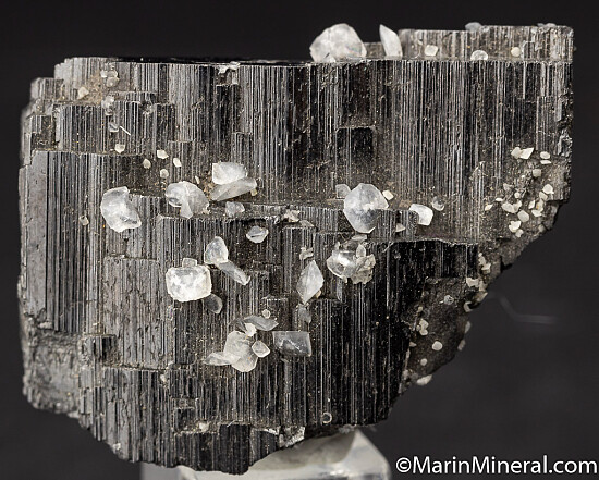 Calcite on Ferberite